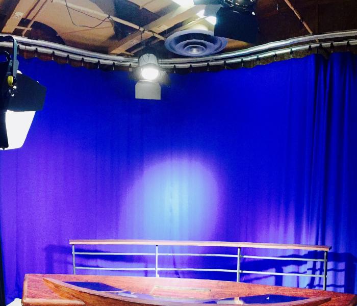 Studio setting with lights and curtain