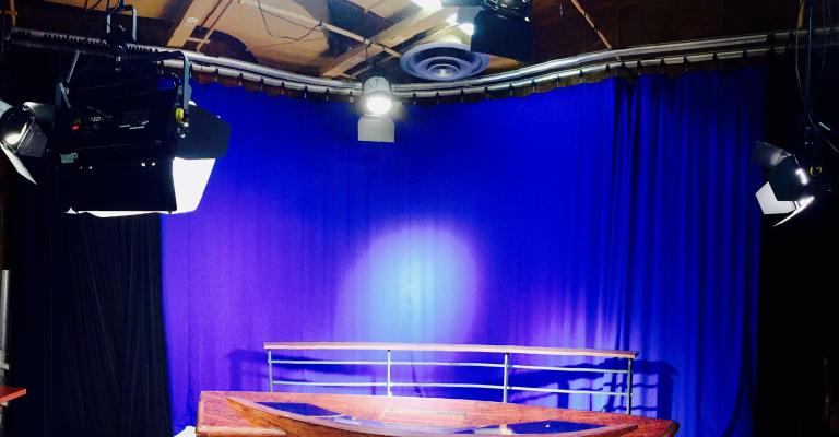 Studio setting with lights and curtain